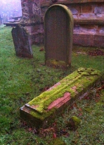 I think that gravestone says "Tired of waiting for the dog to find an acceptable place to piddle"
