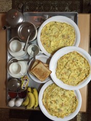 The world's most civilized way to breakfast. First comes a tray with coffee and all the fixings, at which point orders are taken for breakfast omelets to be delivered to the room.