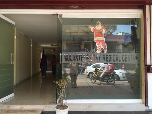 The only landmark we were interested in was a sign for "Toilet". Luckily, Jaya spotted this one at the end of a clinic hallway. 