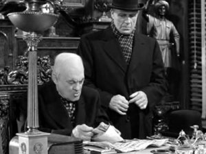 Mr. Potter (Lionel Barrymore) with the bank deposit. That he does not give back. [Image Credit: It's a Wonderful Life, 1946 Directed by Frank Capra]