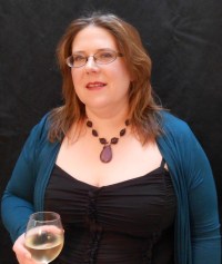 Shawna Reppert, an award-winning author of fantasy and steampunk, is proud of keeping readers up all night and making them miss work deadlines. She believes that fiction should ask questions for which there are no easy answers, while at the same time taking the reader on a fine adventure that grips them heart and soul and keeps them turning pages until the very end. “Definitely give this author a chance,” says one reader, “her storytelling will draw you in. Her style is just a hint of Andre Norton, a dash of J. K. Rowling, and the tiniest pinch of Anne Rice. The rest is her own unique stamp.” Her debut novel, The Stolen Luck, won a silver medal for original-world fantasy in the Global Ebooks Awards and an Eppie for fantasy romance. The first two books of her Ravensblood urban fantasy series won gold medals for contemporary fantasy. The much-awaited sequel, Raven’s Heart, will be released on 2/6/15. Shawna’s love of live Irish music and dance frequently influences her work. Her four-footed children are a Lipizzan stallion and a black-and-orange cat named Samhain who occasionally takes over her blog. Shawna also likes to play with the Society for Creative Anachronism, and can sometimes be found in medieval garb on a caparisoned horse, throwing javelins into innocent hay bales that never did anything to her. She grew up in Pennsylvania, and now lives in the beautiful wine country of Oregon. Each has colored her writing in different ways.